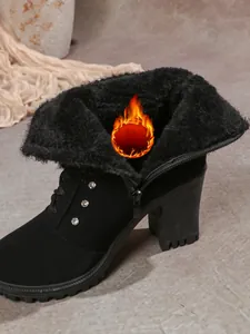 Detailed view of black high heel Martin boots featuring warm fur lining and rhinestone accents