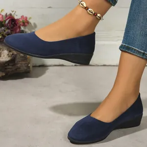 Elegant navy blue suede wedge flats for women featuring a comfortable low wedge heel