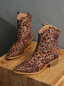 Macro view of leopard print suede Western cowboy ankle boots with chic embroidery
