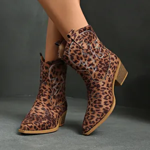 Close-up of stylish leopard print cowboy ankle boots with pointed toe and chunky heel