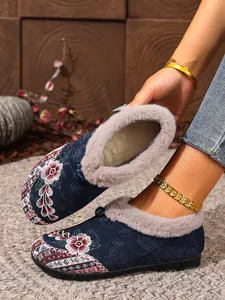 Ethnic floral embroidered winter loafers for women with warm faux fur lining and flat non-slip sole.