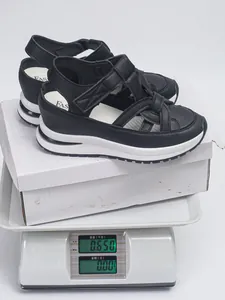 Detail of black platform Roman sandals with hook and loop straps weighing 0.65kg