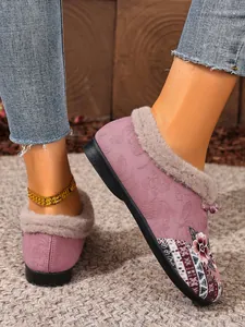 Detail view of purple embroidered ethnic style loafers featuring soft warm plush lining