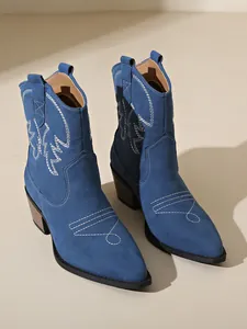 Vintage blue suede western cowboy ankle boots with white stitching and pointed toe