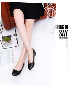 Elegant black low heel work shoes for women shown in a professional lifestyle office setting