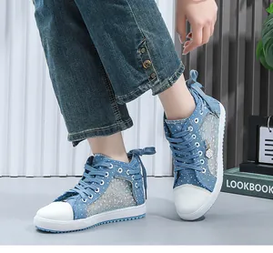 Detailed view of blue lace mesh high-top sneakers with breathable floral panels