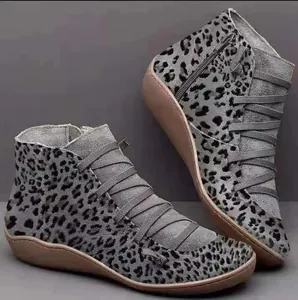 Women's grey leopard print ankle boots featuring flat soles and a side zipper detail