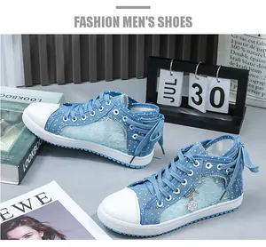 Detailed view of blue lace mesh high-top sneakers with white polka dots and floral charm.