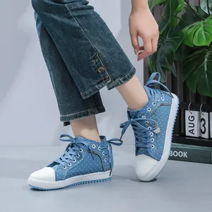 Blue polka dot denim high-top sneakers for women featuring white rubber toe and laces