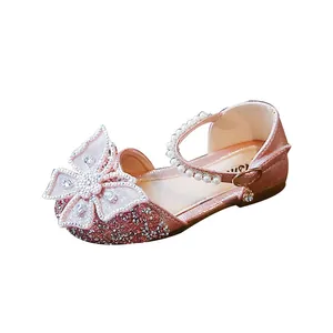 Sparkly pink girls' princess sandals with large butterfly bow and pearl strap details