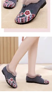 Detailed view of embroidered winter snow boots with warm faux fur lining for women