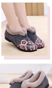 Detailed view of traditional embroidered winter snow boots with warm fur lining.