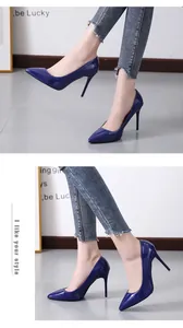 Side view of elegant navy blue patent leather pointed toe stiletto pumps for women