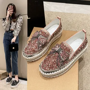 Sparkly pink rhinestone loafers with bow detail and thick platform sole for women