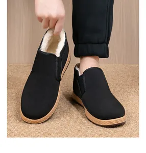 Detail view of the thick white fleece lining inside the black winter cotton shoes.
