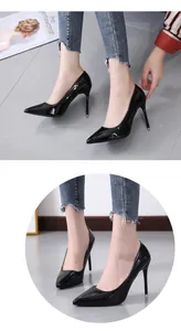 Detailed close-up view of elegant black patent leather pointed-toe stiletto high heels.