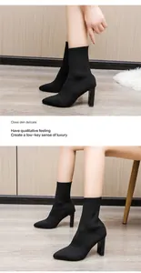 Detailansicht der stylischen schwarzen spitzen Fly-Knit-Sockenstiefel mit Blockabsatz