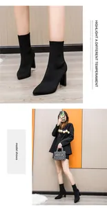 Model trägt schwarze spitze Fly-Knit Stretch-Stiefeletten mit Blockabsatz