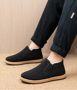 Detailed side view showing warm fleece lining of black men's winter casual cotton shoes.