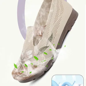 Detailed view of breathable mesh upper and floral embroidery on women's loafers