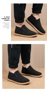 Detail view of men's thermal fleece-lined winter loafers with non-slip soles