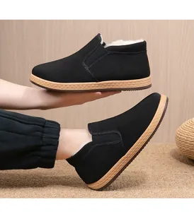 Detail view of men's thermal winter slip-on shoes featuring thick faux fur lining for warmth.