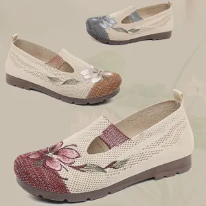 Detailed view of comfortable women's slip-on loafers with traditional flower embroidery