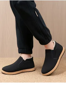 Detailed view of men's black fleece-lined warm winter cloth shoes with anti-slip soles