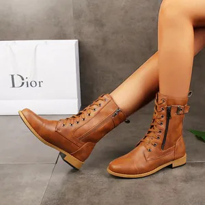 Detailed visual of brown lace-up combat boots featuring a side zipper and rounded toe design.