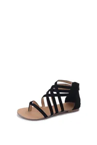 Detailed view of black strappy thong gladiator sandals with a comfortable flat sole