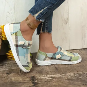 Stylish plaid canvas loafers for women, comfortable slip-on flat shoes shown on model.