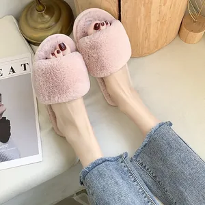Stylish women's pink faux fur open-toe slippers featuring a cozy single-strap design for indoor home use