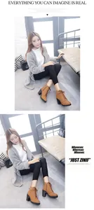 Model wearing brown high-heeled chunky platform ankle boots in an indoor setting