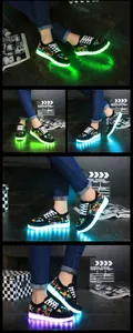 Close-up of LED light-up sneakers with colorful graffiti patterns and glowing soles.