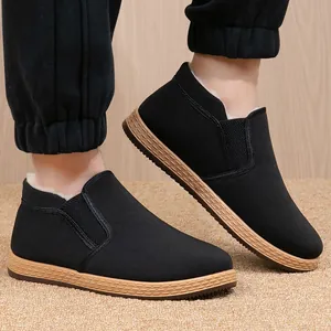 Men's warm winter fleece-lined slip-on shoes with anti-slip rubber soles in black.