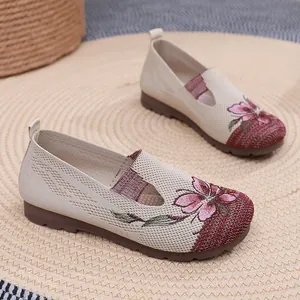 Detailed view of comfortable women's loafers with exquisite floral embroidery and knit texture
