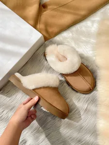Detail of camel suede platform slippers with thick white plush faux fur lining
