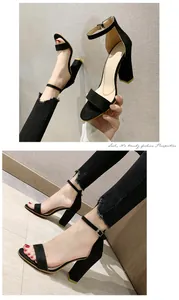 Detail view of black suede chunky heel sandals with ankle straps and frayed jeans.