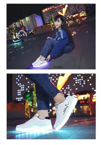 Detail shot of white LED light-up shuffle shoes with glowing blue soles at night