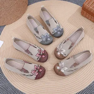 Display of women's breathable mesh slip-on shoes with elegant floral embroidery
