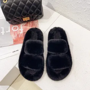 Close-up of premium black fuzzy slippers with double wide straps for indoor winter warmth