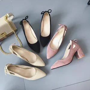 Elegant pointed-toe chunky heel pumps with decorative heel bows in black, pink, and beige