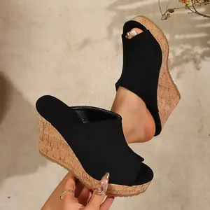 Stylish black peep-toe wedge sandals with comfortable cork-textured platform sole for women