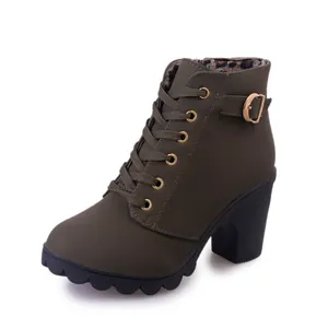 Women's olive green platform ankle boots with high block heels and buckle detail.