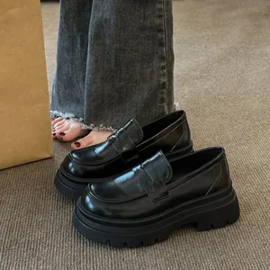 Classic black platform loafers for women with chunky heels and Japanese retro design style