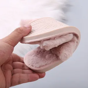 Close-up showing the extreme flexibility and soft sole of the pink furry slipper