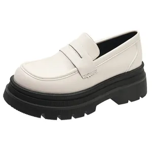 Vintage off-white platform loafers for women with chunky black lug soles and JK style