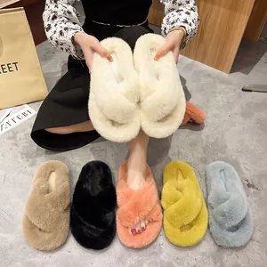 Variety of colorful faux fur cross strap platform slippers for women shown in lifestyle set
