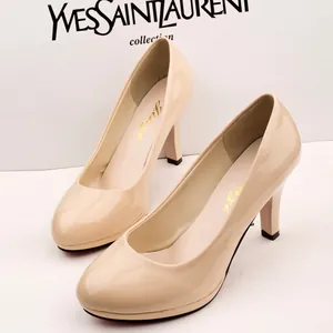 Elegant nude round toe pumps with high stiletto heels and platform for professional women