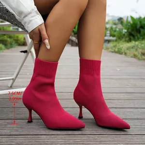 Detailed view of red knitted high-heel sock boots with 7.5cm pointed toe slim heel